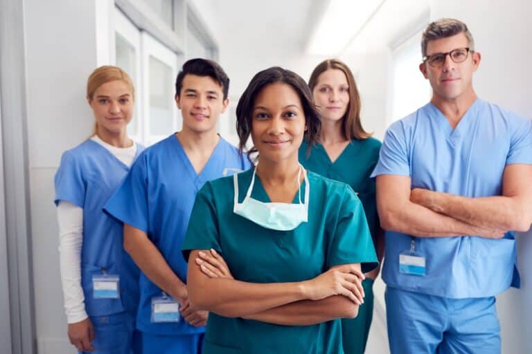 Healthcare professionals in a hospital corridor