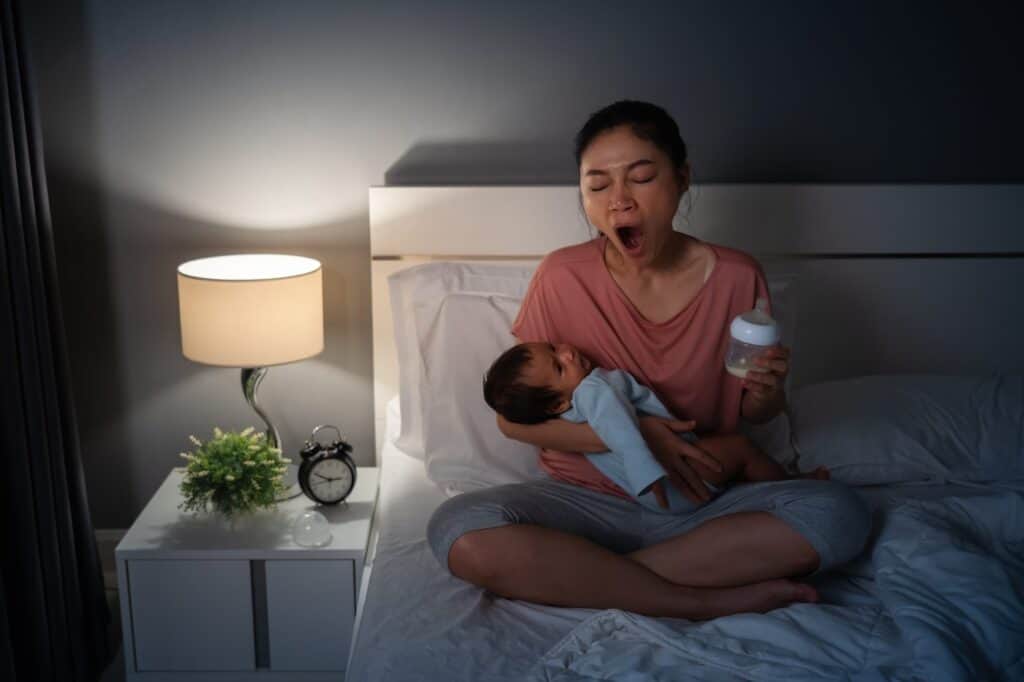 Tired parent awake at night with a baby